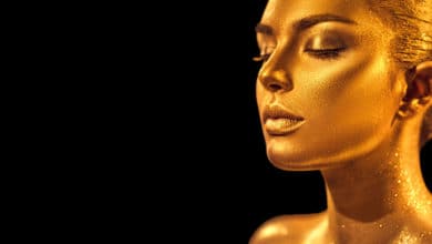 Woman with golden glowing skin